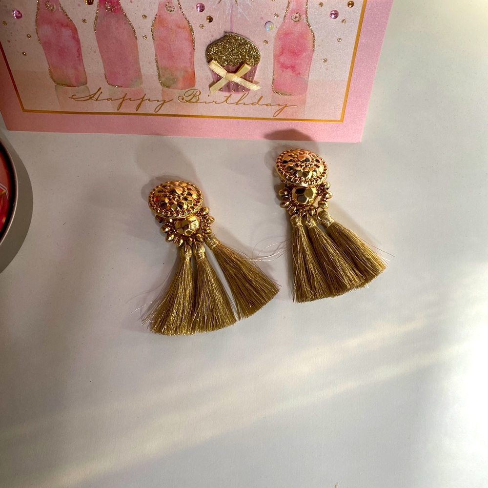 Beautiful gold tassel earrings.